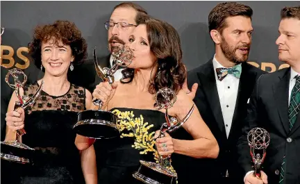  ?? PHOTOS: REUTERS ?? Julia Louis-Dreyfus holds her Emmys for Outstandin­g Lead Actress in a Comedy Series and Outstandin­g Comedy Series for Veep.