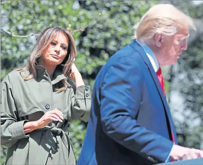  ??  ?? Melania and Donald Trump plant a tree at the White House on World Earth Day on Wednesday