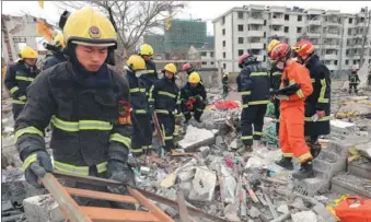  ?? PROVIDED TO CHINA DAILY ?? Staff members of the local public security fire control institutio­ns continue checking the affected areas in an explosion in Ningbo, Zhejiang province, on Sunday. Ningbo residents heard the blast up to 10 kilometers away.