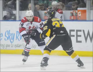  ?? Herald photo by Dale Woodard ?? Lethbridge Hurricanes forward Dylan Cozens tries to get past Brandon Wheat Kings captain and defenceman James Shearer during Game 2 of the teams’ Western Hockey League Eastern Conference semifinal series Saturday night at the Enmax Centre.