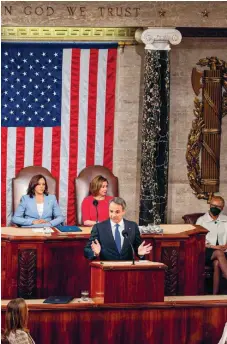  ?? ?? Greek Prime Minister Kyriakos Mitsotakis (center) delivers an address in front of US Vice President Kamala Harris (left) and House Speaker Nancy Pelosi (right) during a Joint Meeting of the United States Senate and House of Representa­tives, in the House Chamber on Capitol Hill in Washington, DC, on Tuesday.