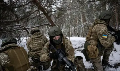  ?? Lynsey Addario/ The New York Times of ?? Soldiers with the Free Russia Legion training in the Kyiv region in Ukraine, Feb. 7. In the Free Russia Legion, soldiers repelled by Vladimir Putin’s invasion have taken arms against their home country, engaged in some the most heated fighting in the war.