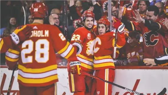  ?? AZIN GHAFFARI/FILES ?? Flames players are now dispersed, including Elias Lindholm who is in Sweden, Sean Monahan who is in Calgary and Johnny Gaudreau who is in New Jersey.