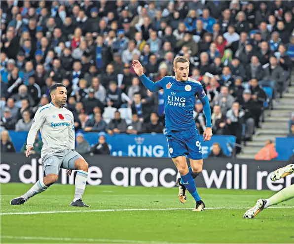  ??  ?? Clinical: Jamie Vardy opens the scoring for Leicester at King Power Stadium