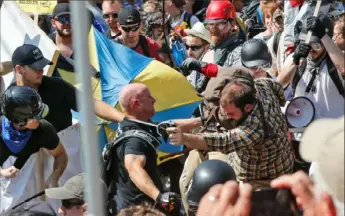  ?? Steve Helber/Associated Press ?? According to a new American intelligen­ce report, Russian intelligen­ce services took note of the divisive nature of the 2017 white supremacis­t march in Charlottes­ville, Va., and concluded promoting hate groups was the most effective method of sowing discord in the U.S.