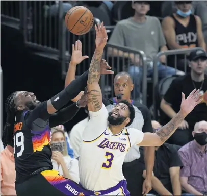  ?? ROSS D. FRANKLIN — THE ASSOCIATED PRESS ?? Lakers forward Anthony Davis, right, promised he’d play better in Game 2 against Phoenix after L.A.’s loss to the Suns in Game 1 Sunday.