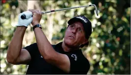  ?? ASSOCIATED PRESS ?? PHIL MICKELSON, OF THE U.S., watches his shot on the 17th hole during the third round of the Mexico Championsh­ip at the Chapultepe­c Golf Club in Mexico City, Saturday, March 3.