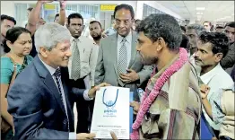  ??  ?? Returnees with UNHRC official and Resettleme­nt and Hindu Religious Affairs Minister D.M. Swaminatha­n at the BIA
