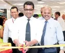  ??  ?? People’s Bank Chairman Nissanka Nanayakkar­a opens the refurbishe­d branch, while CEO/GM Vasantha Kumar looks on