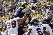  ?? PAUL SANCYA — THE ASSOCIATED PRESS ?? Michigan running back Blake Corum dives for a one-yard touchdown run against Northern Illinois in Saturday’s win.