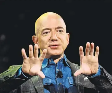  ?? Mark Ralston AFP/Getty Images ?? THE STATEMENT by the Business Roundtable, which includes Amazon’s Jeff Bezos, ref lects a sea change in chief executives’ attitudes toward challenges to their management principle coming from social organizati­ons.