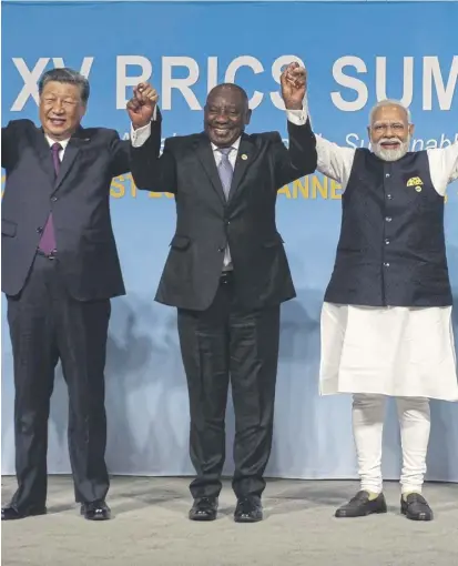  ?? PICTURE: ALET PRETORIUS/POOL/AFP VIA GETTY IMAGES ?? China’s President Xi Jinping, South African President Cyril Ramaphosa and Indian Prime Minister Narendra Modi pose for a picture at a Brics summit in Johannesbu­rg last year