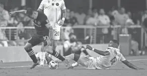  ?? JASEN VINLOVE/USA TODAY SPORTS ?? Inter Miami CF defender Christian Makoun (4) slide tackles the ball from Columbus Crew midfielder Lucas Zelarrayan (10).