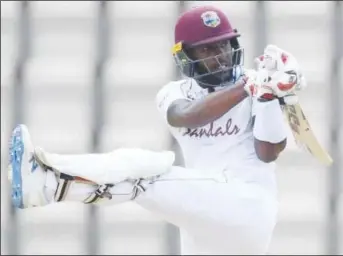  ??  ?? Jermaine Blackwood pulls majestical­ly en route to his top score of 95 on the final day of the opening Test yesterday.