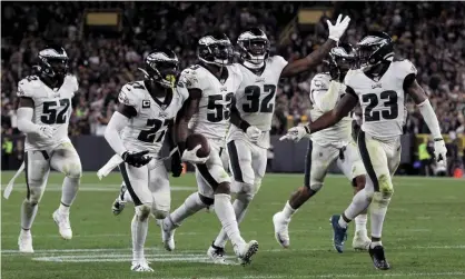  ?? Photograph: Dylan Buell/Getty Images ?? Nigel Bradham (53) of the Philadelph­ia Eagles celebrates with team-mates after making an intercepti­on in the final minutes against the Green Bay Packers.