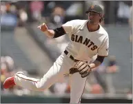  ??  ?? Giants starting pitcher Kevin Gausman works in the first inning against the Arizona Diamondbac­ks Thursday in San Francisco.