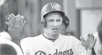  ?? GARY A. VASQUEZ/USA TODAY SPORTS ?? Dodgers shortstop Corey Seager celebrates after scoring a run against the Marlins in the sixth inning at Dodger Stadium.