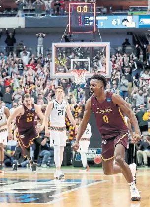  ?? TOM PENNINGTON/GETTY IMAGES ?? Loyola’s Donte Ingram celebrates after his game-winning three-pointer. “Any one of us could have hit that shot, but I was just fortunate enough to be in the position,” he said.