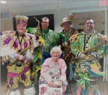  ?? SUBMITTED PHOTO ?? Southwest Philadelph­ia native Betty MacMillan, above, spent an afternoon strolling memory lane listening to “the happiest music on Earth.” Four members of the Woodland String Band recently delighted the residents at Riddle Village in an event hosted by Compassus. The band members wore their brilliantl­y-colored, bedazzled costumes from four previous New Year’s Day parades, and played familiar music that had the residents tapping, clapping, and strutting in their seats. MacMillan fondly recalled attending the Mummers Parades with her family and how the Mummers hosted Open Houses in her neighborho­od.