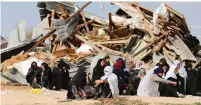  ?? (Ammar Awad/Reuters) ?? BEDUIN WOMEN sit next to the ruins of their homes that security forces bulldozed in the Negev village of Umm al-Hiran on January 18.