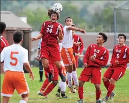  ?? AUSTIN HERTZOG - DIGITAL FIRST MEDIA ?? Owen J. Roberts defender Austin Koury wins a header over Perkiomen Valley’s Michael Weir during Wednesday’s game.