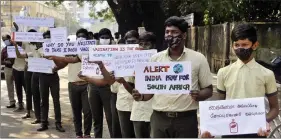  ?? ANI ?? School students hold placards while participat­ing in an awareness campaign on the Omicron variant of Covid-19, in Chennai on Saturday.