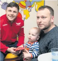  ??  ?? Scarlets winger Steff Evans meets a young fan.