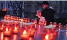 ?? AFP/Getty Images ?? A monk lights a candle in Lviv on 26 November 2022 to commemorat­e the victims of the 1932-33 Holodomor in Ukraine, a famine created by Stalin in which millions died. Photograph: Yuriy Dyachyshyn/