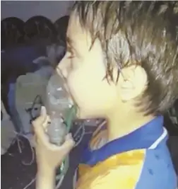  ?? SYRIAN CIVIL DEFENSE WHITE HELMETS PHOTO VIA AP ?? This image taken from video shows a toddler being given oxygen through a respirator following an alleged poison gas attack in the opposition-held town of Douma, Syria.