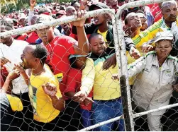  ?? PICTURE: NOKUTHULA MBATHA ?? INFIGHTING: Trade union members during a Workers’ Day rally in Bloemfonte­in fight among themselves over whether President Jacob Zuma address them, and demanded that he step down.