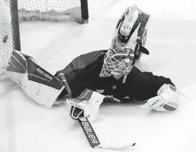  ?? DISPATCH] [JOSHUA A. BICKEL/ ?? Blue Jackets goaltender Elvis Merzlikins looks back after allowing a goal during a team scrimmage last Monday at the Ohiohealth Ice Haus.