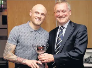  ?? Photograph­s courtesy of www.mphotograp­hic.co.uk ?? ●●Sam Minihan receives the Young Player of the Year award from chairman Richard Park