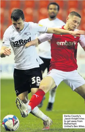  ??  ?? Derby County’s Jason Knight tries to get away from Rotherham United’s Ben Wiles.