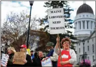  ?? (AP/Robert F. Bukaty) ?? Protesters rally Saturday in Augusta, Maine, against executive orders by Gov. Janet Mills to keep some businesses closed.