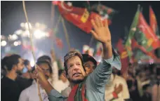  ?? AFP; Reuters ?? Top, Prime Minister Imran Khan’s personal austerity drive will do little to reduce Pakistan’s need for a $12bn bailout; and above, supporters of Mr Khan’s Pakistan Tehreek-e-Insaf party will want promises of more jobs and housing to be kept