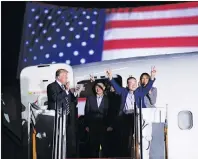  ?? AP PHOTO ?? President Donald Trump, from left, greets Tony Kim, Kim Hak Song, seen in the shadow, and Kim Dong Chul, three Americans detained in North Korea for more than a year, as they arrive at Andrews Air Force Base in Md., Thursday.