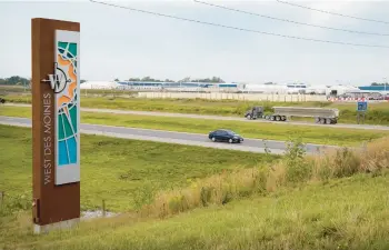  ?? CHARLIE NEIBERGALL/AP ?? Traffic on Interstate 35 passes a Microsoft data center Sept. 5 in West Des Moines, Iowa.