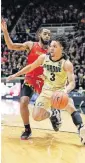  ?? [AP PHOTO] ?? Purdue guard Carsen Edwards (3) drives in front of Maryland guard Eric Ayala during the second half Thursday in West Lafayette, Ind.