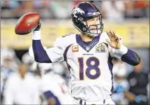  ?? RONALD MARTINEZ / GETTY IMAGES ?? One of the NFL’s greatest QBs, Peyton Manning needed help from Denver’s defense to win his second title.