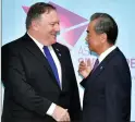  ?? AP PHOTO/JOSEPH NAIR ?? U.S. Secretary of State Mike Pompeo, left, and China's Foreign Minister Wang Yi pose for a photograph ahead of a bilateral meeting on the sidelines of the 51st ASEAN Foreign Ministers Meeting in Singapore, Friday.