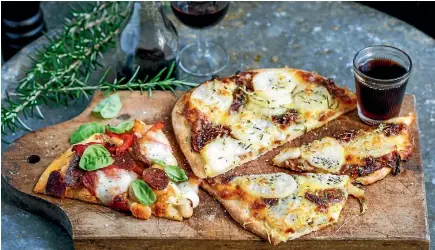  ??  ?? Potato, caramelise­d onion and rosemary pizza or chorizo pizza with roast capsicum, butter beans and mozzarella? They’re easy to make and delicious to eat.