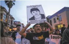  ?? Gabrielle Lurie / Special to The Chronicle 2016 ?? Jesus Ruiz protests on 24th Street at a demonstrat­ion marking the anniversar­y of Amilcar Perez-Lopez’s death.