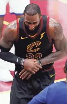  ?? EPA-EFE ?? LeBron James hurt his hand after punching a whiteboard following Cleveland’s Game 1 loss.