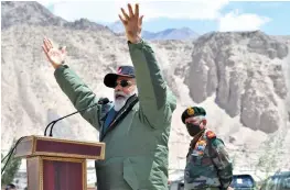  ??  ?? Prime Minister Narendra Modi addresses Indian troops during his visit to a forward post at Nimu in Ladakh on Friday. CDS Gen. Bipin Rawat is seen on the right.