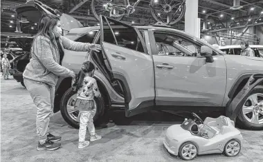  ?? Mark Mulligan/Staff photograph­er ?? Romi Camarillo is among the Houstonian­s who have had to consider buying new cars this year against the backdrop of rising prices and a lack of inventory.