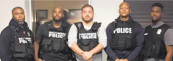  ?? BALTIMORE POLICE DEPARTMENT ?? Detective Marcus Taylor, second from left, was convicted Monday with Detective Daniel Hersl in the Gun Trace Task Force corruption case. With Taylor are other members of the task force, from left, Detective Evodio Hendrix, Sgt. Wayne Jenkins, Detective...