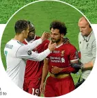  ?? ?? Mohamed Salah is consoled by Cristiano Ronaldo, left, after leaving the field injured in the 2018 final.