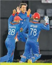  ?? AFP ?? Rashid Khan (centre) has been the face of Afghanista­n recently.