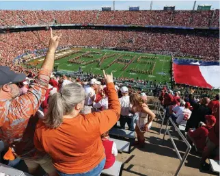  ?? ?? The annual college football Red River Rivalry between Texas and Oklahoma will be played at Cotton Bowl Stadium through 2036.