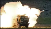  ?? TONY OVERMAN — THE OLYMPIAN ?? A launch truck fires the High Mobility Artillery Rocket System produced by Lockheed Martin during combat training at the Yakima Training Center in Washington.